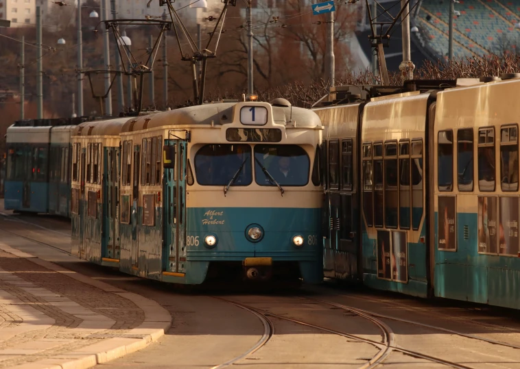 a couple of trains on a city street