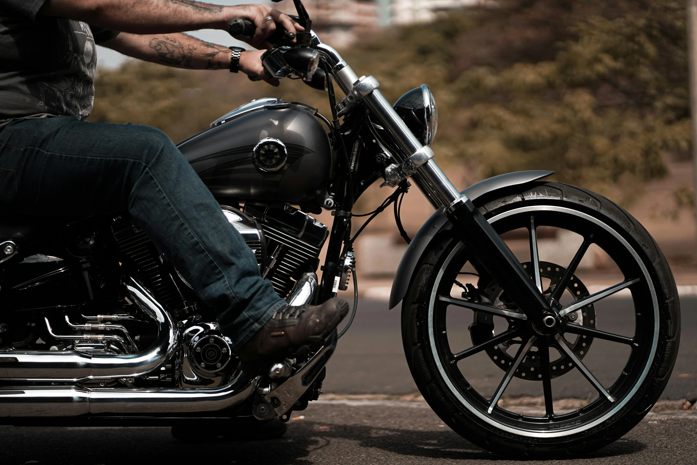 a man is riding a motor bike on the road