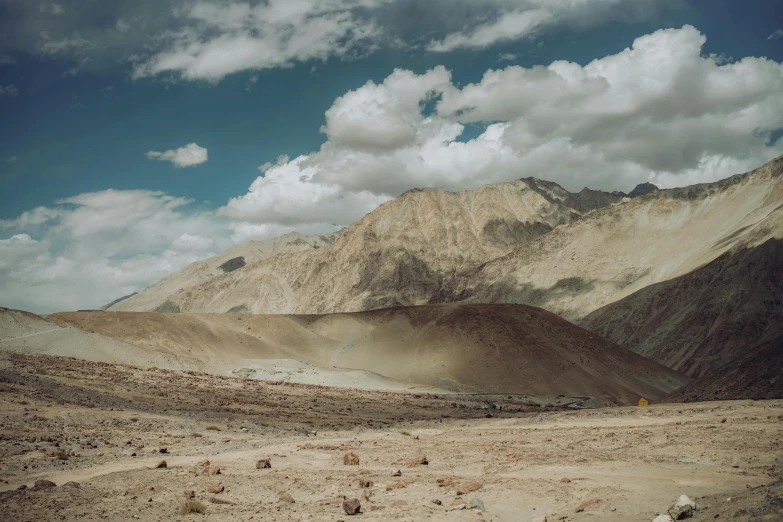 a mountain with rocky mountains next to it