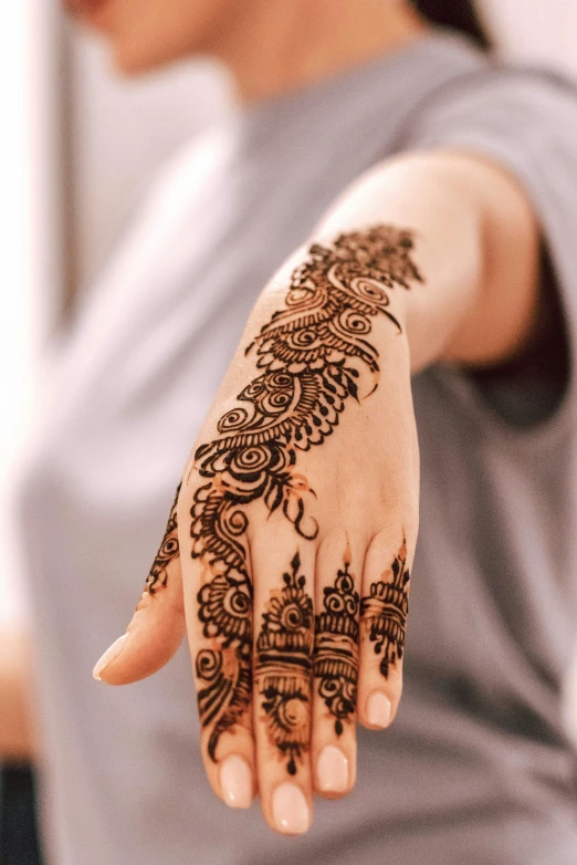 the arm is covered with a henna on it