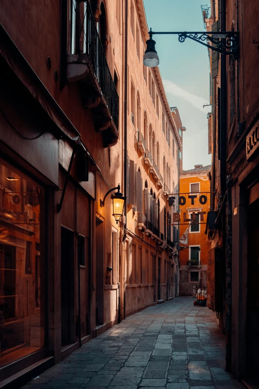 an empty street with a large building in the back ground