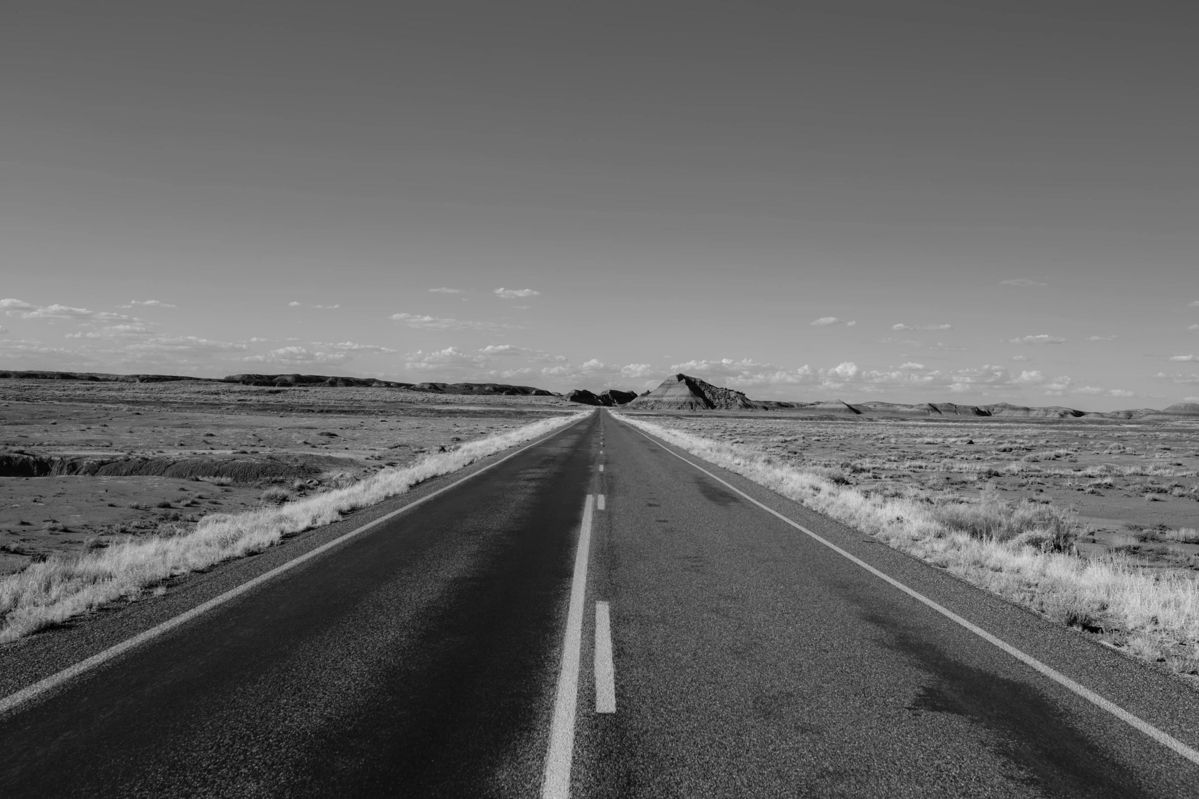 a highway going to a desert with no traffic