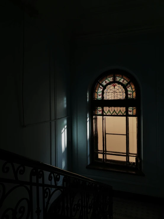 window lit up in the darkness of a building