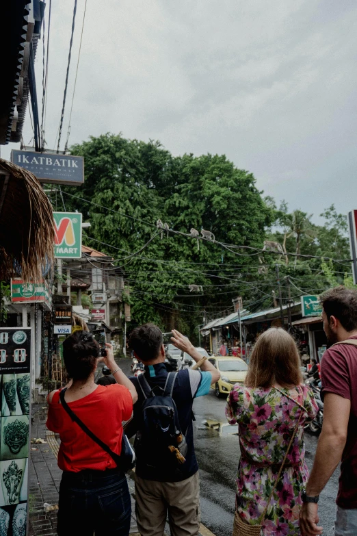 a group of people that are standing in the street