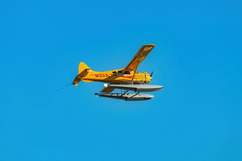 an airplane flying in the clear blue sky