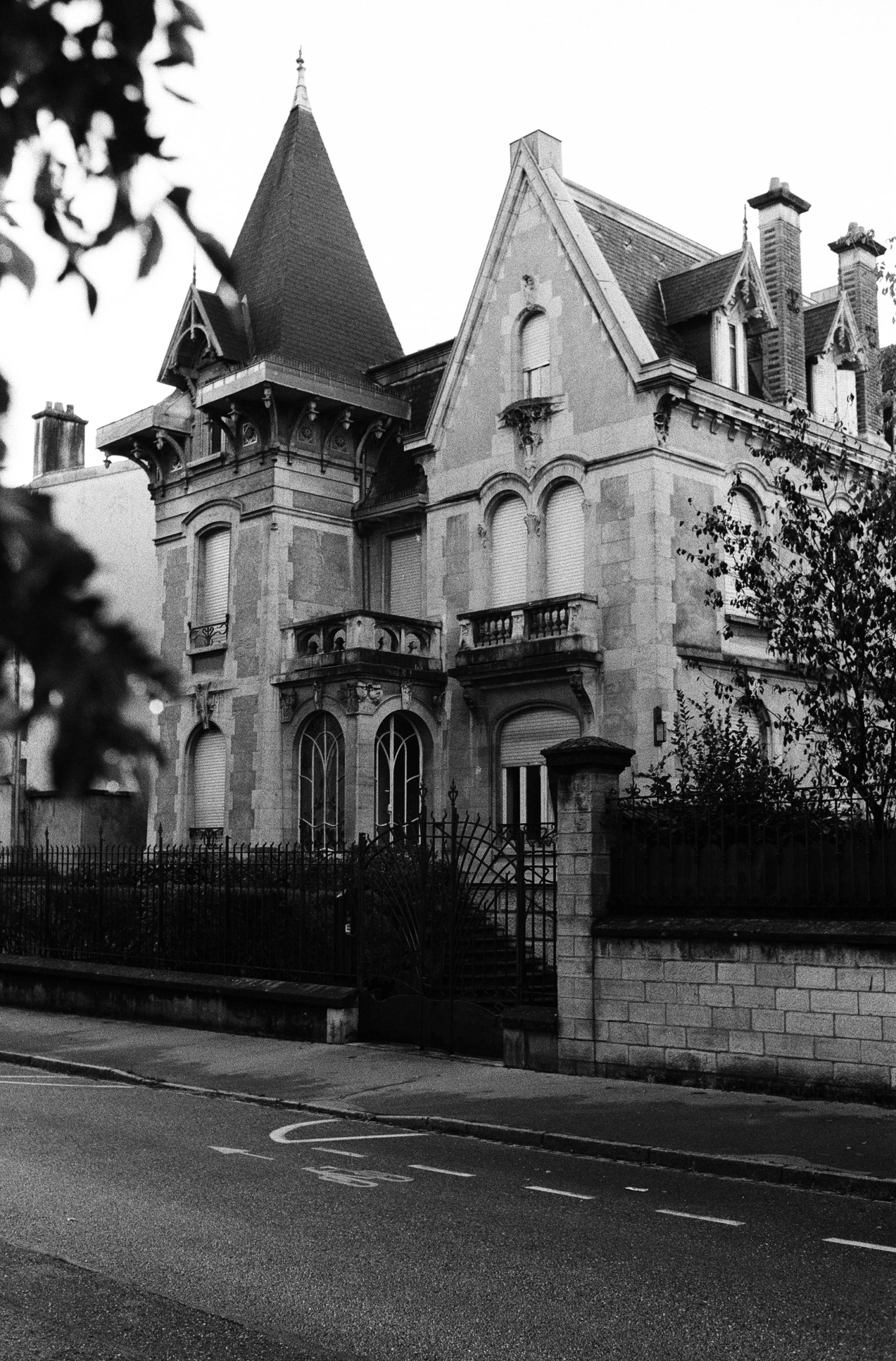 an old, two story building in the center of a street