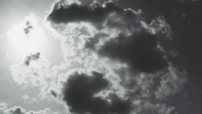 the sky above a very tall tower with some clouds