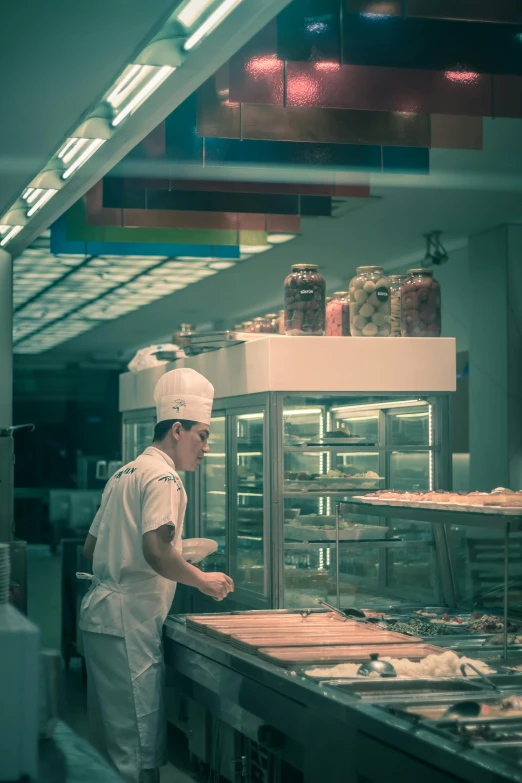 a man preparing food inside of a commercial oven