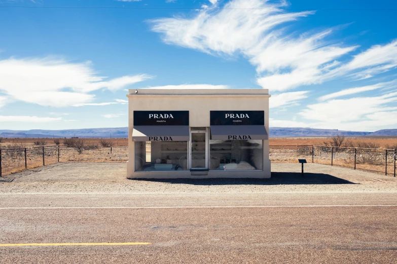 an out building sits empty on the side of the road