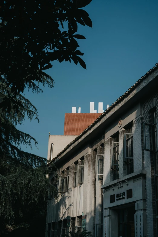 a large building with a sky background behind it