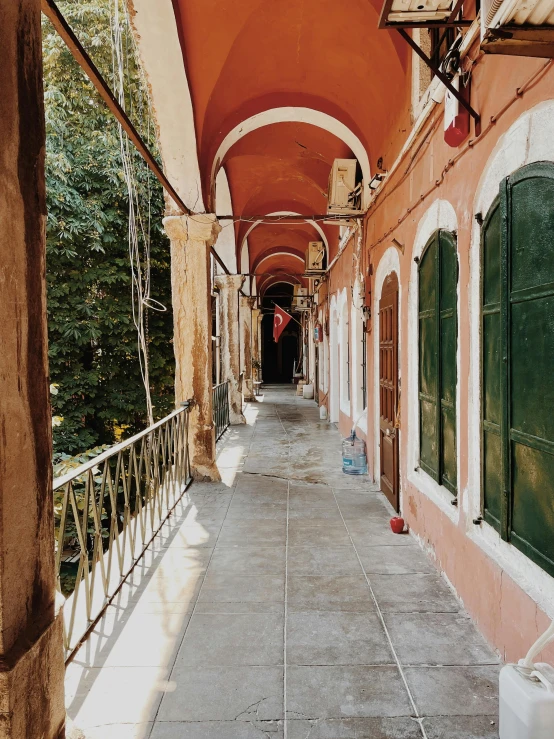 a building has many red walls and green windows