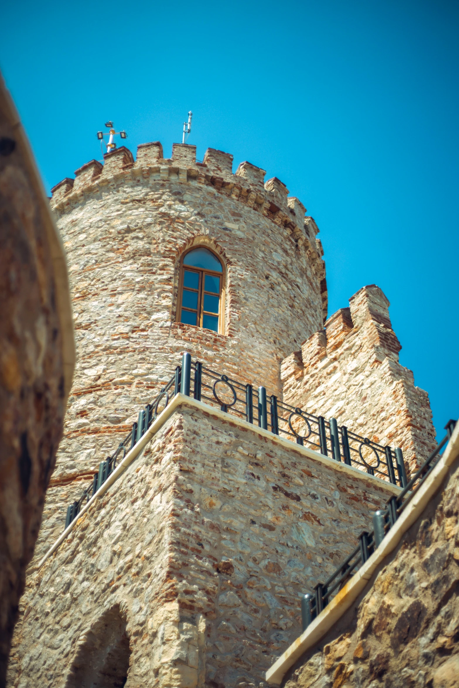 looking up at the tower of a building