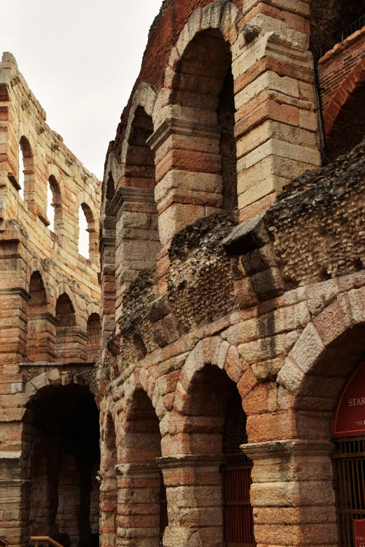 a building with an arched tower is surrounded by bricks