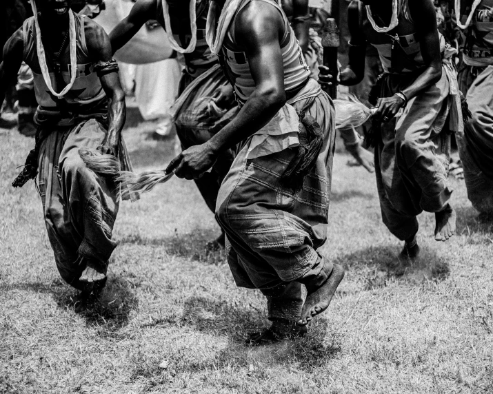 men in ceremonial dress dancing together at an event