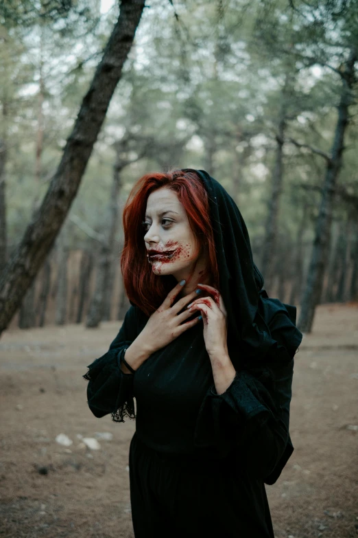 a woman with red hair and makeup, dressed as a  from the film bride of chucky crampss, poses for a po