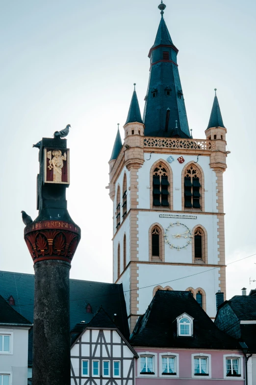 a tall church tower with a clock on it