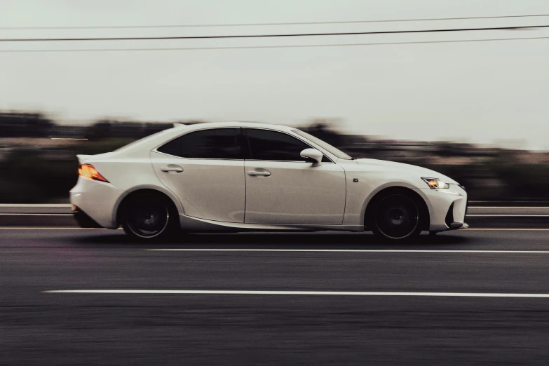 a white car that is on the road