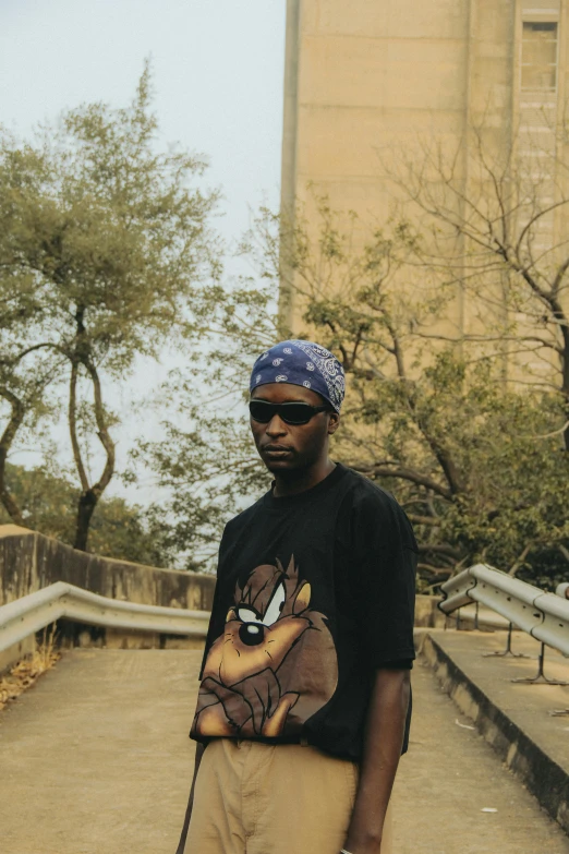 a man is holding his skateboard in the city