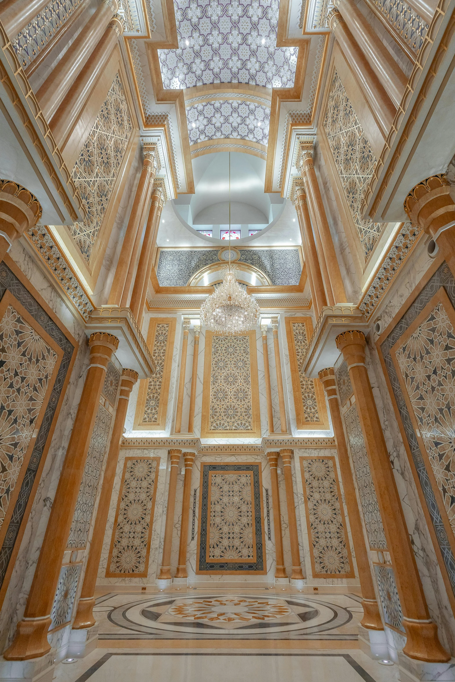 an elegant ceiling with intricate decoration with golden trim