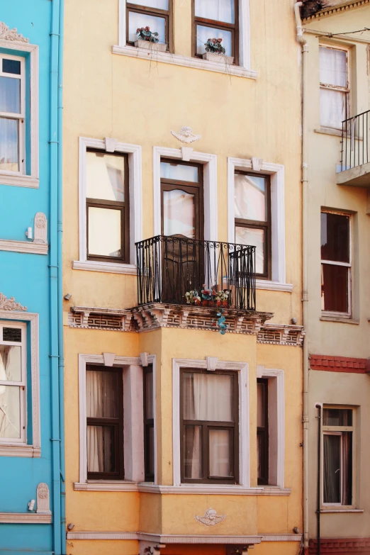 a multi colored building with a balcony and balconies