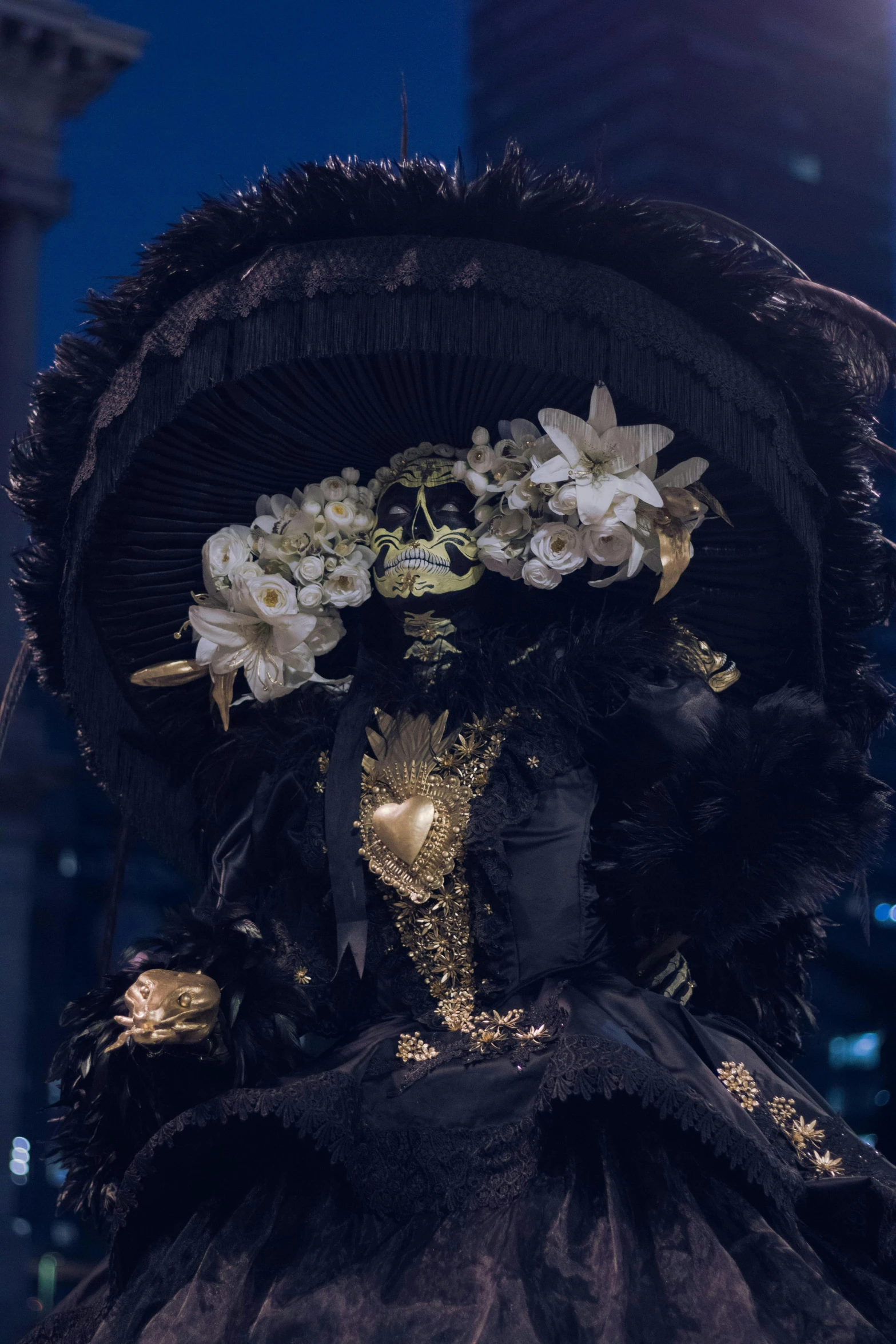 a beautiful woman wearing a large black hat with flowers on it