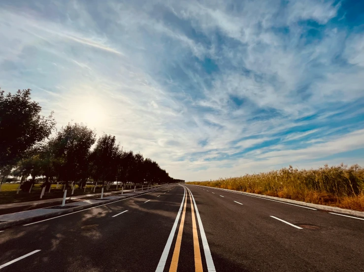 the view down a deserted street looking to the sky