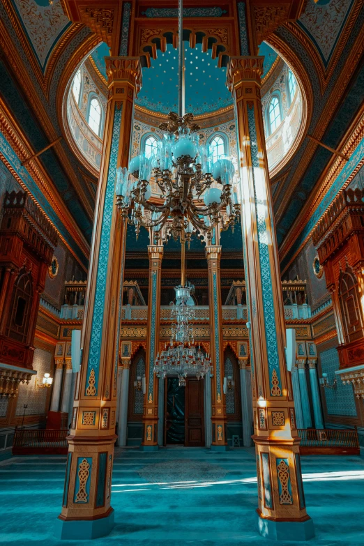 a chandelier hangs from the ceiling in a blue and white room