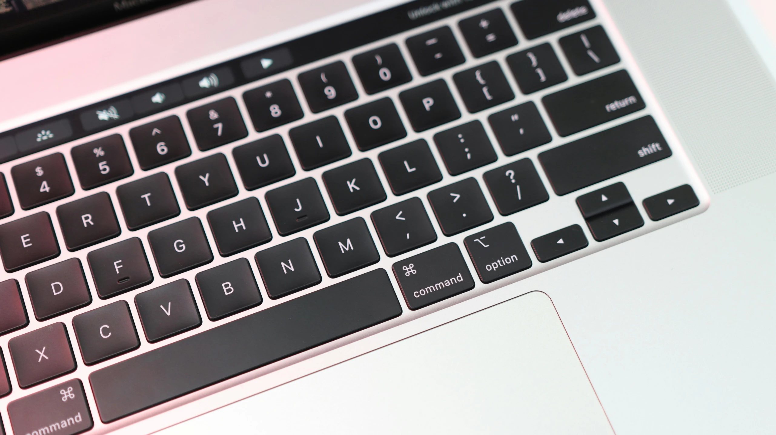 a laptop is turned on and sitting on the table