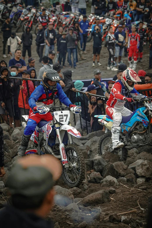 a man riding a motorcycle with another person on it