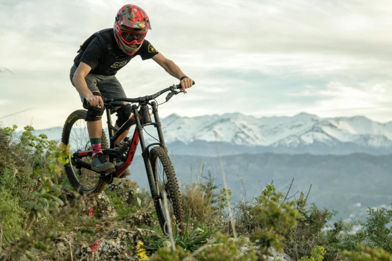 a cyclist doing a trick on his mountain bike