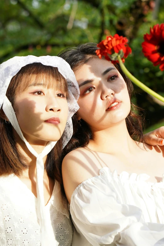 two women dressed in colonial clothing standing next to each other