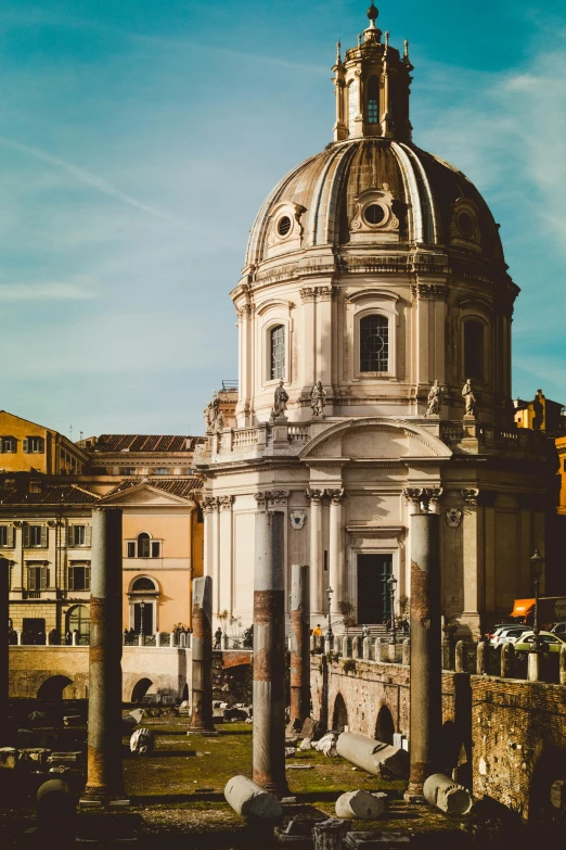 a church is shown next to several smaller buildings