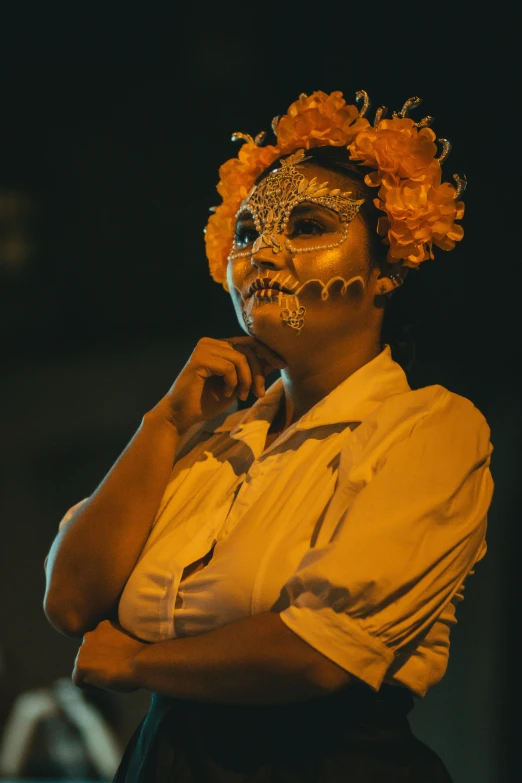 a man with painted face and floral headdress