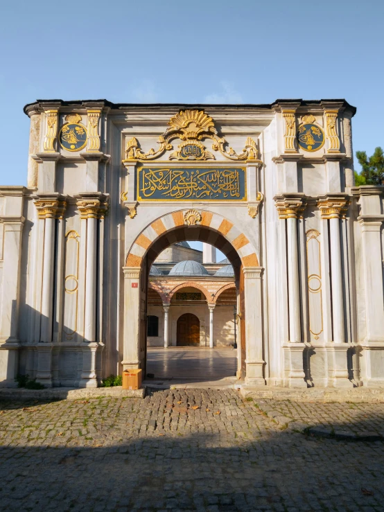 a large doorway leading into a courtyard with lots of architecture