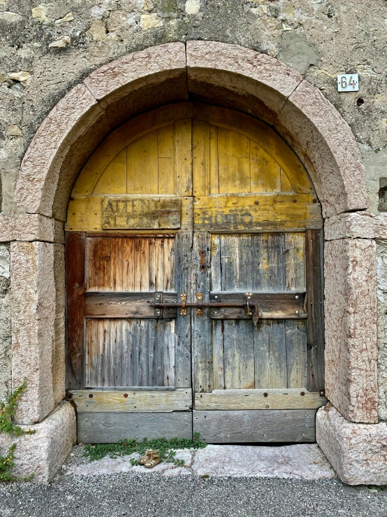 the inside of a building with two wooden doors