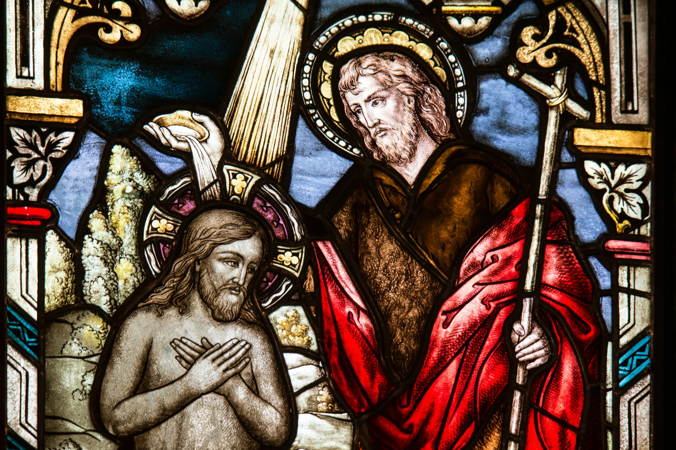 a stained glass window showing jesus holding a flag