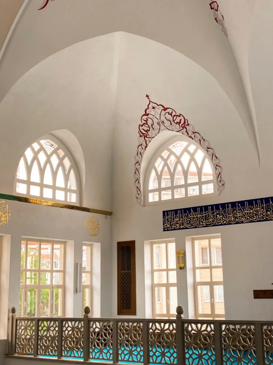 a blue tiled floor in an archwayed building