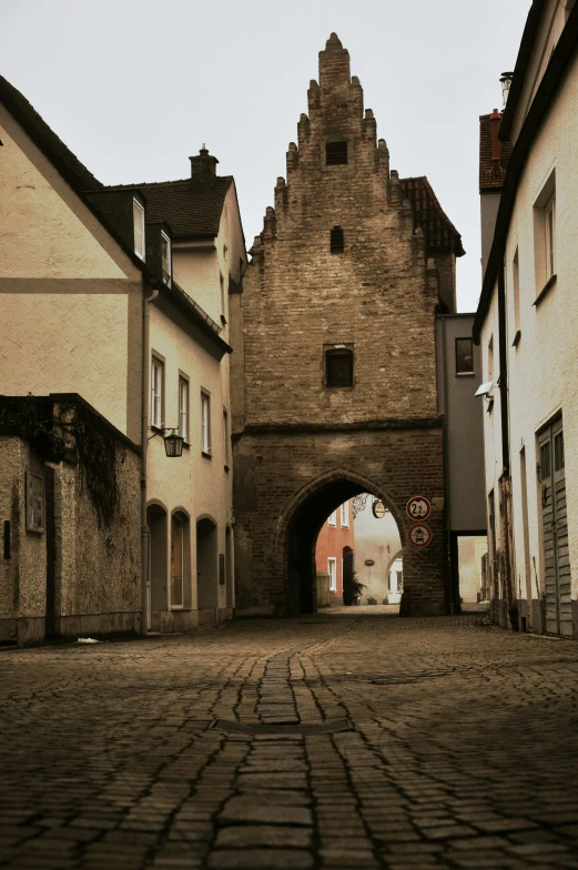 there is a cobble stone street in an old town