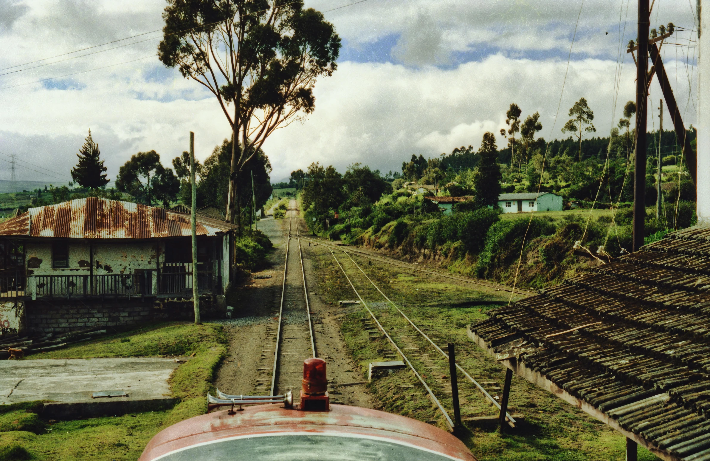 a view of railroad tracks in a rural setting