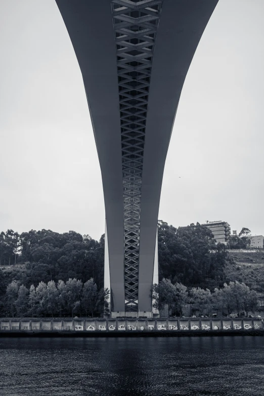 a view of the underside of a bridge over water