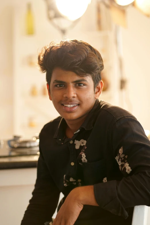 a person sitting at a table in front of some food