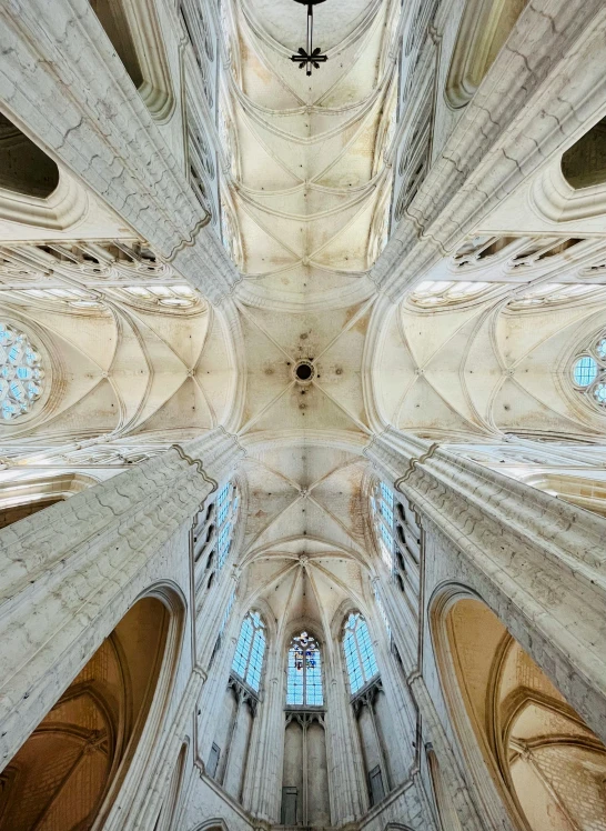 the inside of a cathedral looking up at the vaulted ceiling