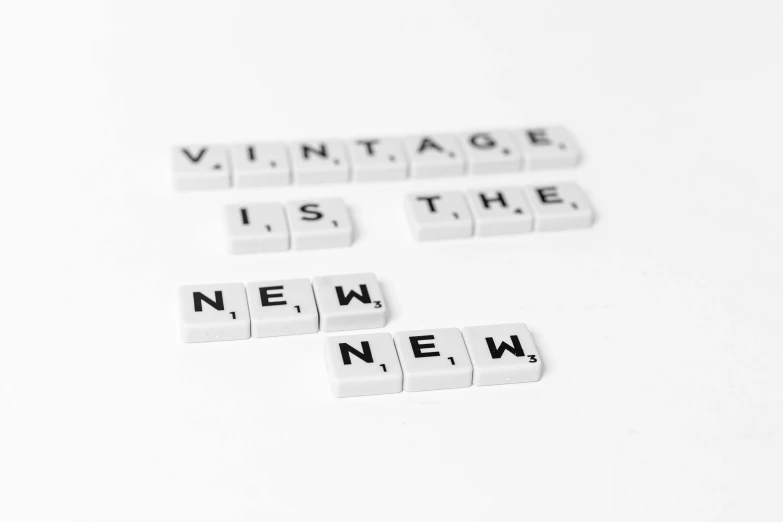 there are three pieces of scrabble tile that say'vintage is the new '