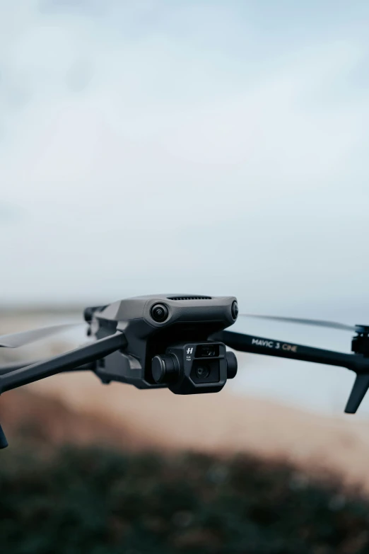 the camera is strapped to a small helicopter