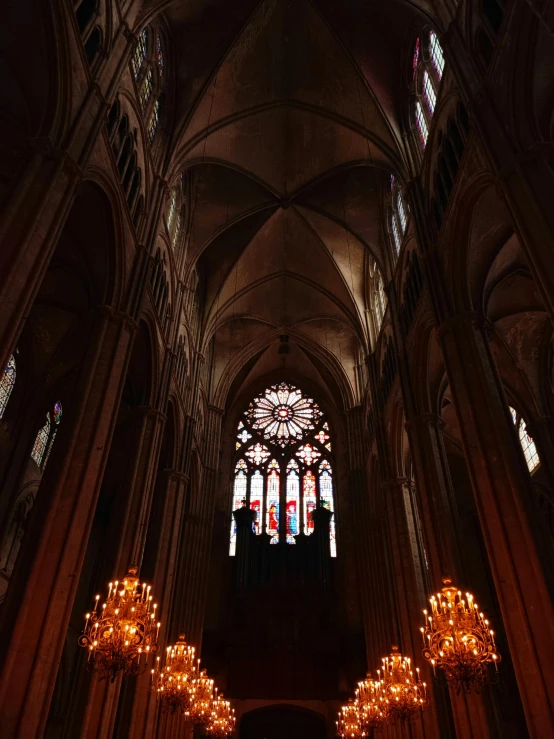 a very large cathedral with chandeliers and lights