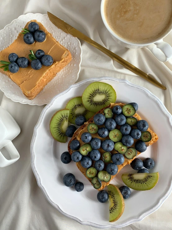 a plate with fruit on it and some slices of cake