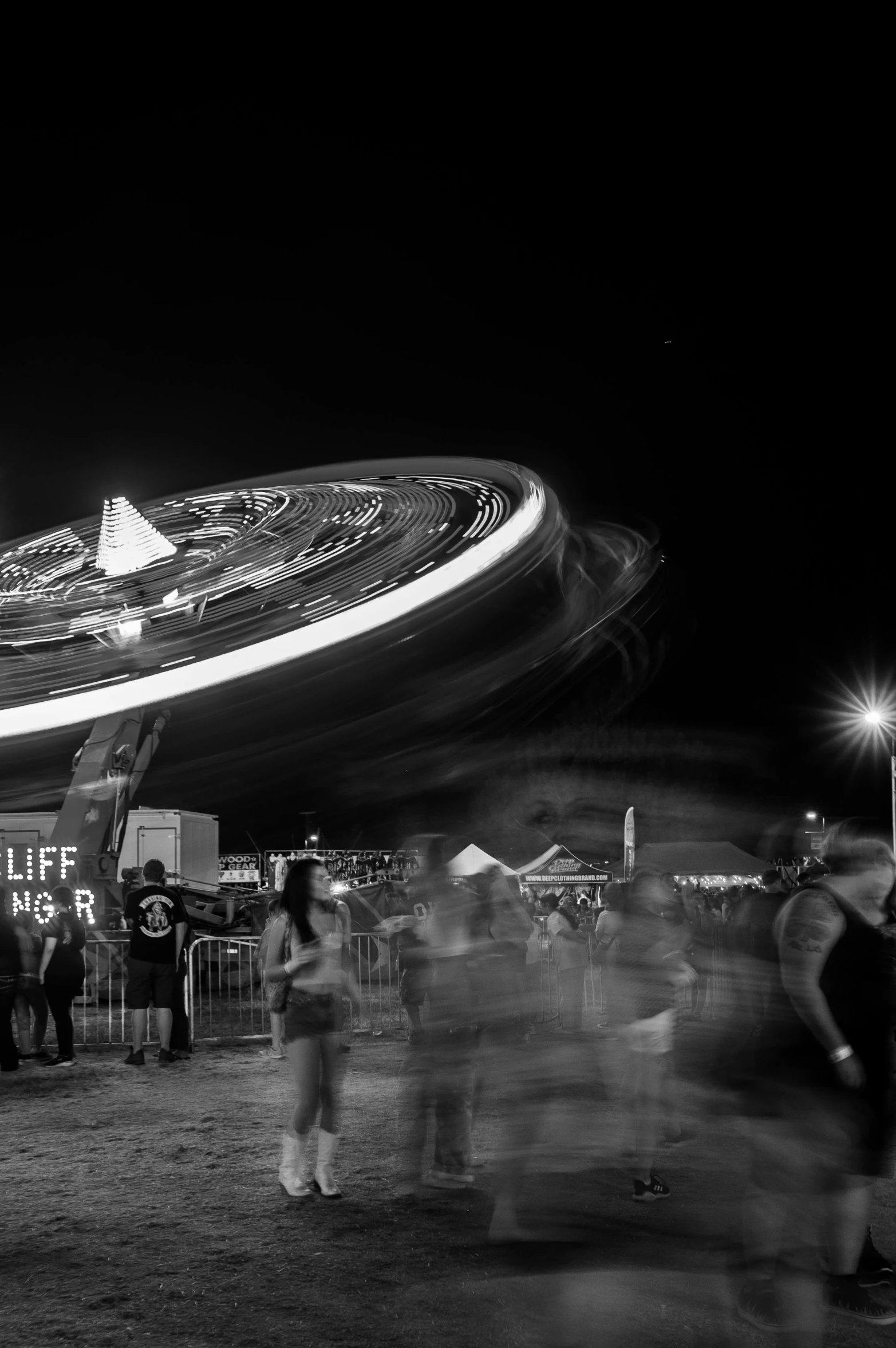 the fairground at night is lit up and lit up