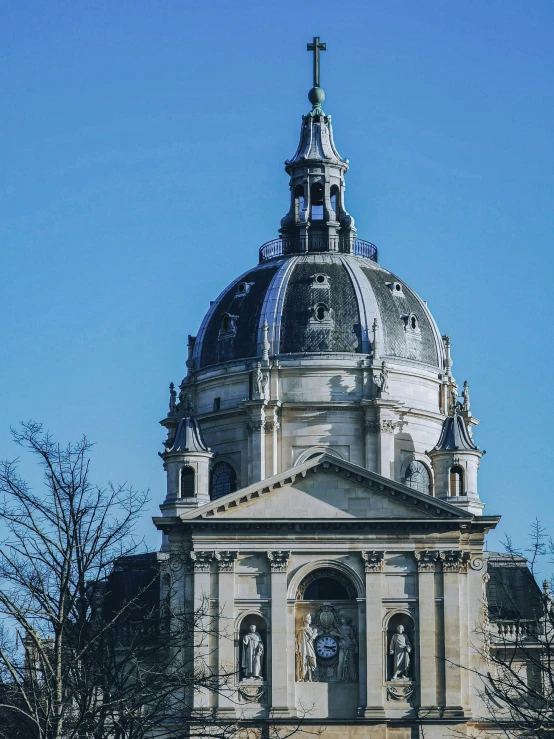 an old building with a steeple with a cross on it