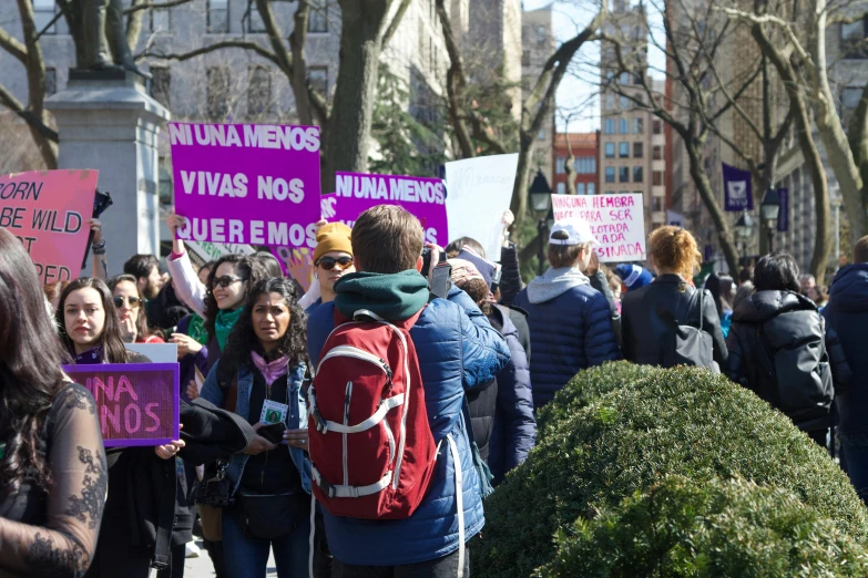 a large group of people are protesting outside