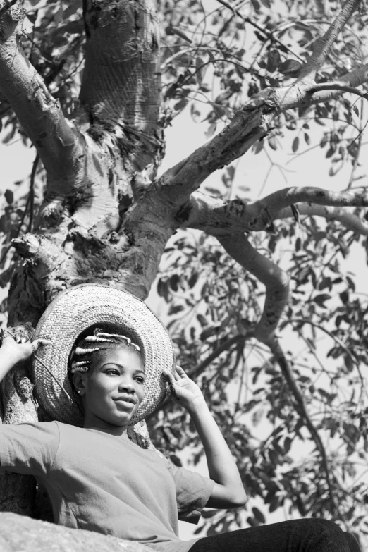 a young child wearing a large straw hat